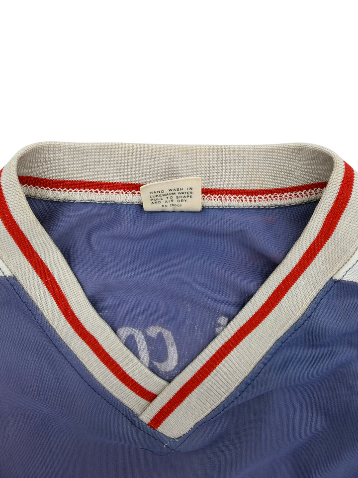 Exile Vintage 1970s Outlaws baseball jersey collar detail with red and grey striped trim and care label