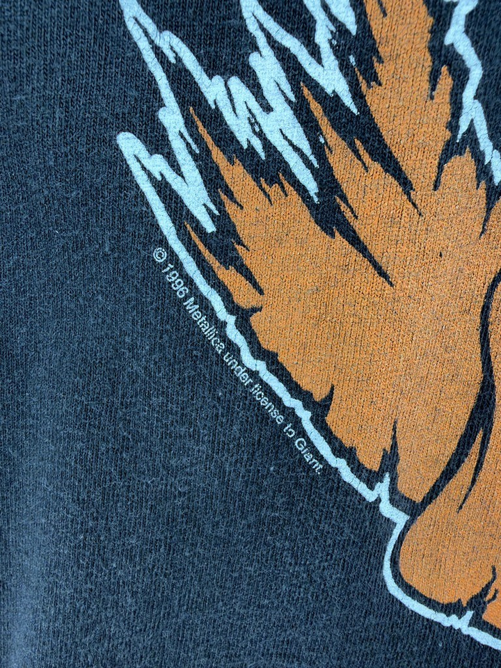 Exile Vintage 1996 Metallica Loadapalooza graphic t-shirt detail showing copyright print on black cotton fabric