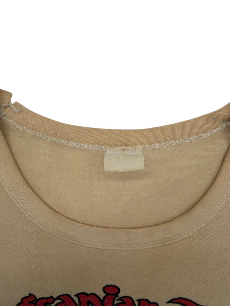 Exile Vintage tan 1970s Philippines t-shirt with a worn blank neck label and crew neckline