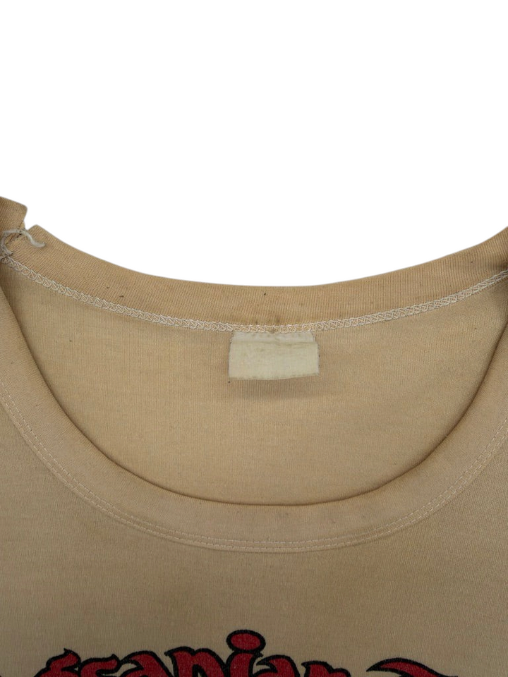 Exile Vintage tan 1970s Philippines t-shirt with a worn blank neck label and crew neckline