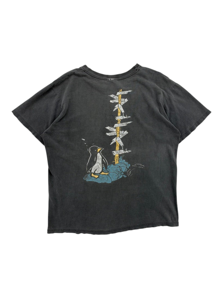 Exile Vintage 1990s Fleetwood Mac tour t-shirt in faded black with a penguin and signpost graphic on the back