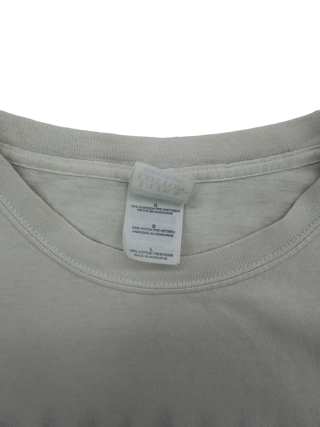 Exile Vintage 2001 Creed weathered white cotton t-shirt tag detail showing size L and preshrunk fabric