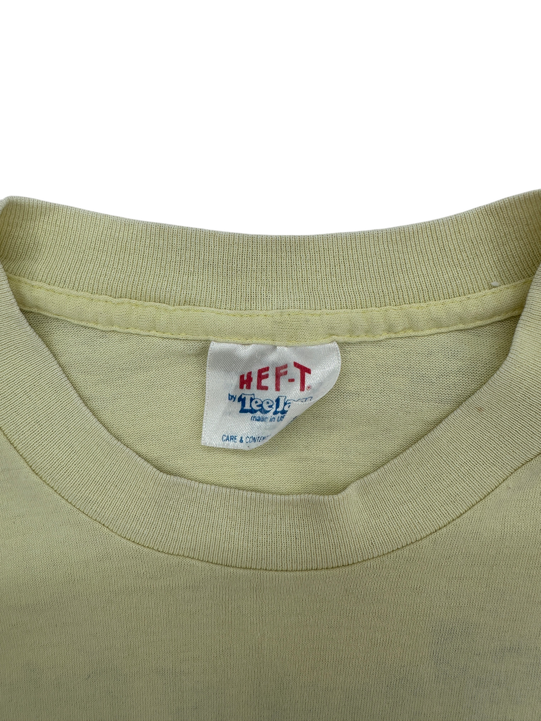 Exile Vintage 1980s Beloit Fall Run t-shirt featuring a yellow cotton fabric and a Heft-T by Tee Jays neck label.