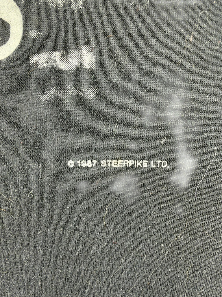 Exile Vintage 1980s Sting t-shirt fabric detail showing 1987 Steerpike Ltd copyright print on black cotton