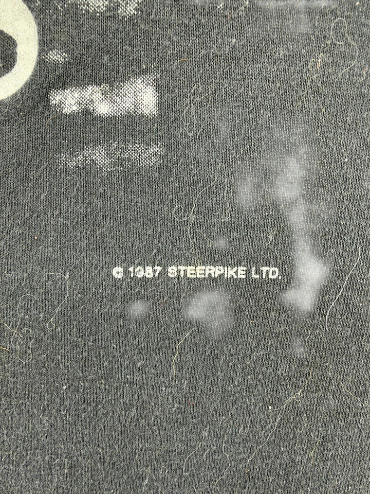 Exile Vintage 1980s Sting t-shirt fabric detail showing 1987 Steerpike Ltd copyright print on black cotton
