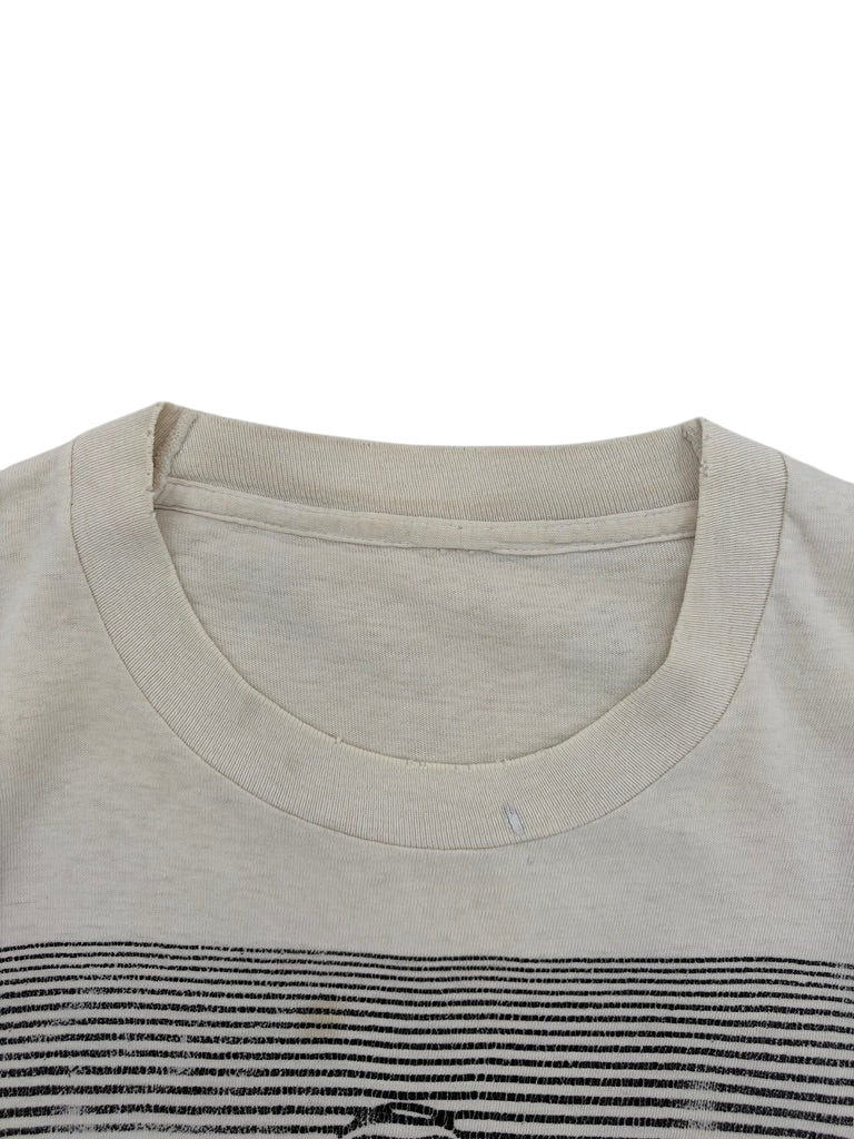 Exile Vintage 1980s optical illusion t-shirt featuring a cream cotton fabric with a black striped graphic detail.