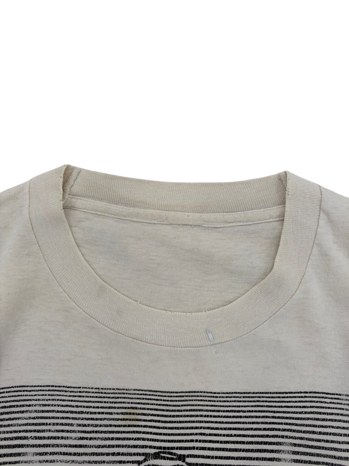 Exile Vintage 1980s optical illusion t-shirt featuring a cream cotton fabric with a black striped graphic detail.