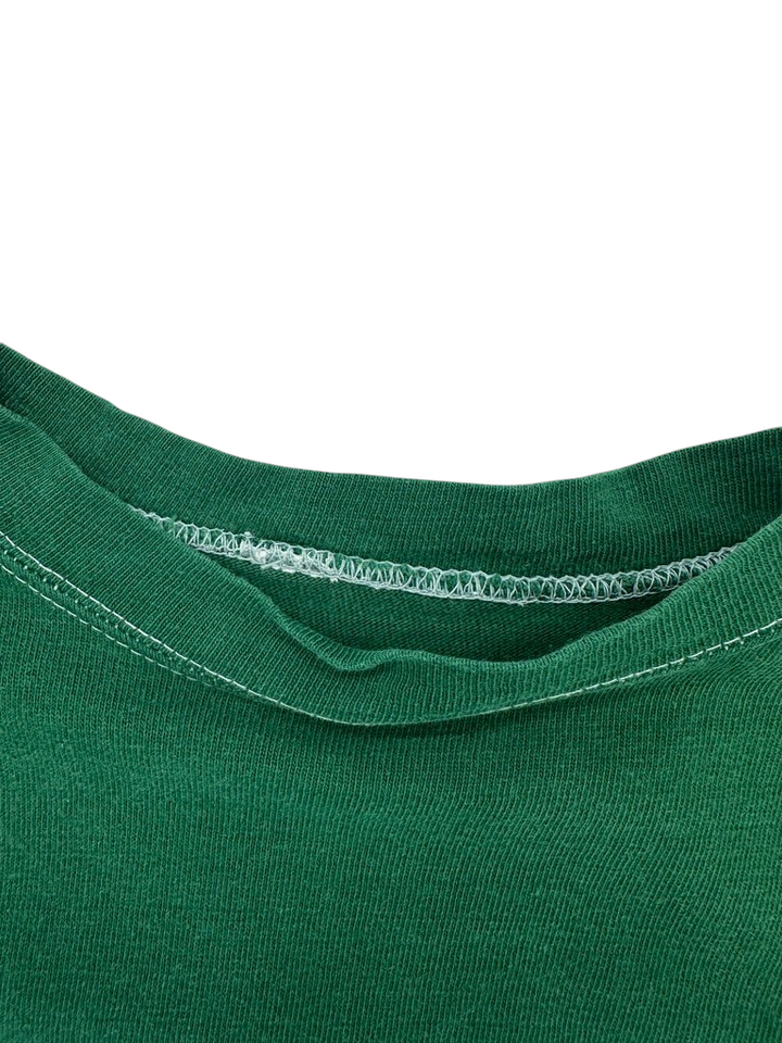 Exile Vintage 1970s green football jersey shirt featuring a classic crew neck collar with white stitching detail