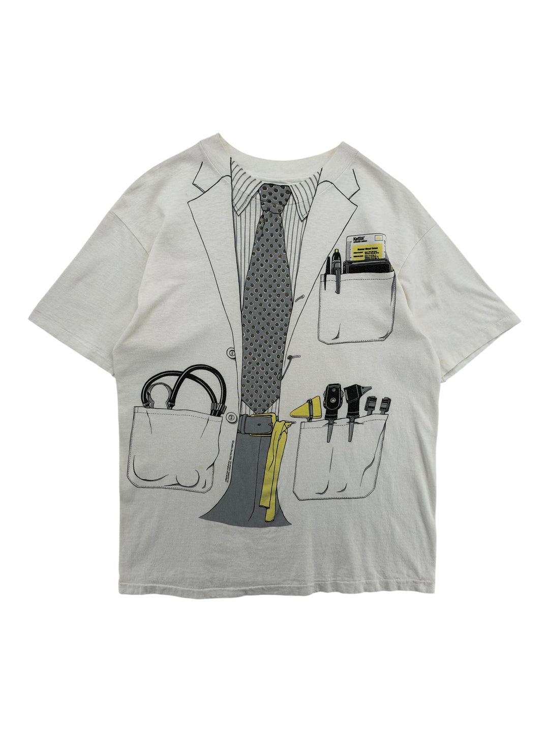 Exile Vintage 1980s white t-shirt with all-over print of a doctor's lab coat, tie, and medical tools