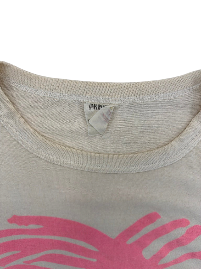 Exile Vintage 1980s Ray-Ban graphic t-shirt collar detail with worn tag on off-white cotton fabric