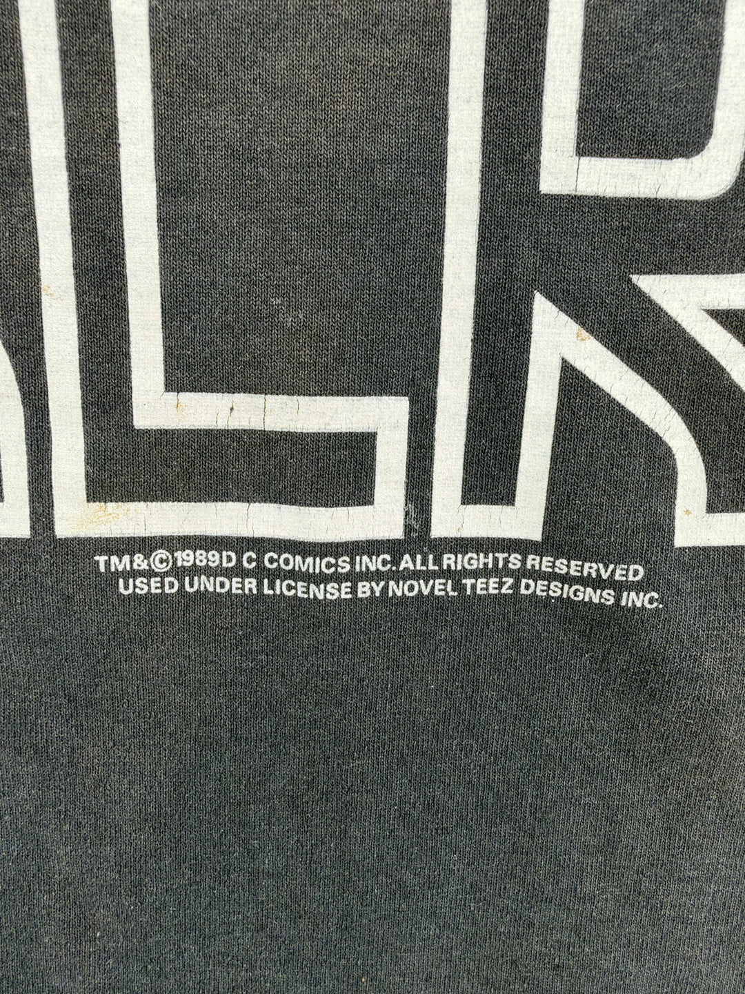 Exile Vintage 1980s Batman The Joker t-shirt detail showing 1989 DC Comics copyright print on black cotton fabric