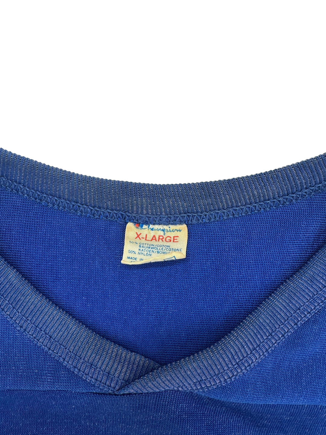 Exile Vintage 1980s New York Giants jersey featuring a blue Champion XL tag with cotton and nylon fabric details