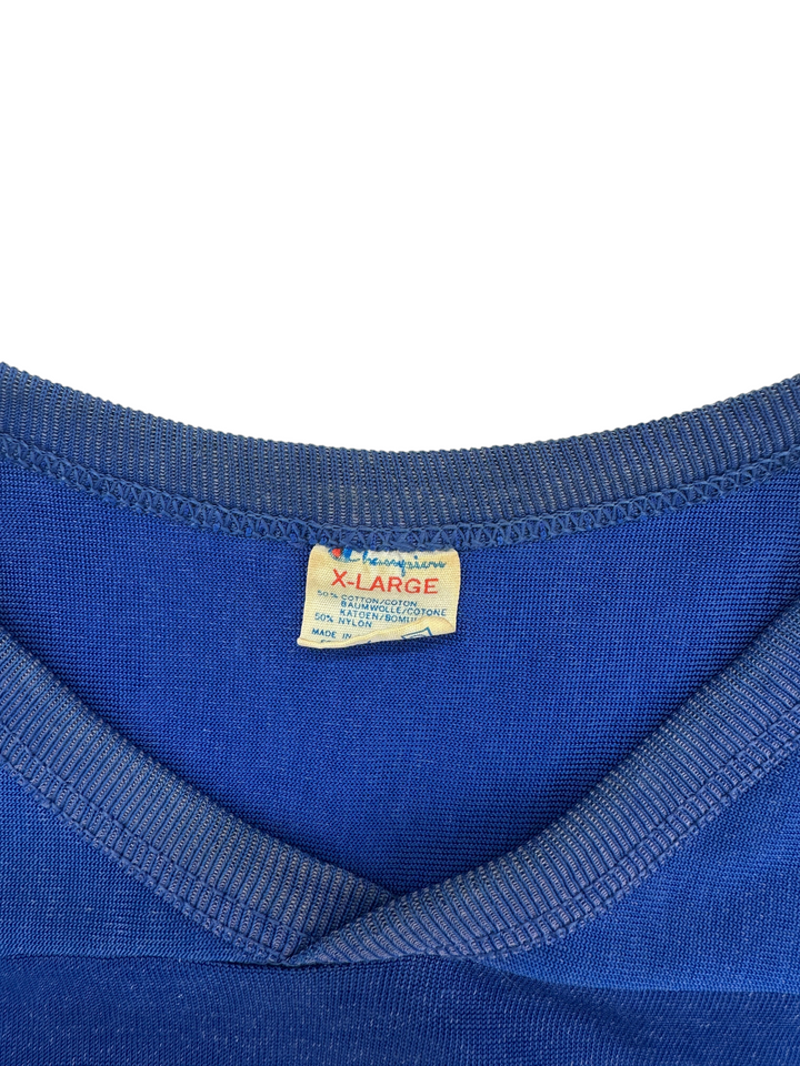 Exile Vintage 1980s New York Giants jersey featuring a blue Champion XL tag with cotton and nylon fabric details