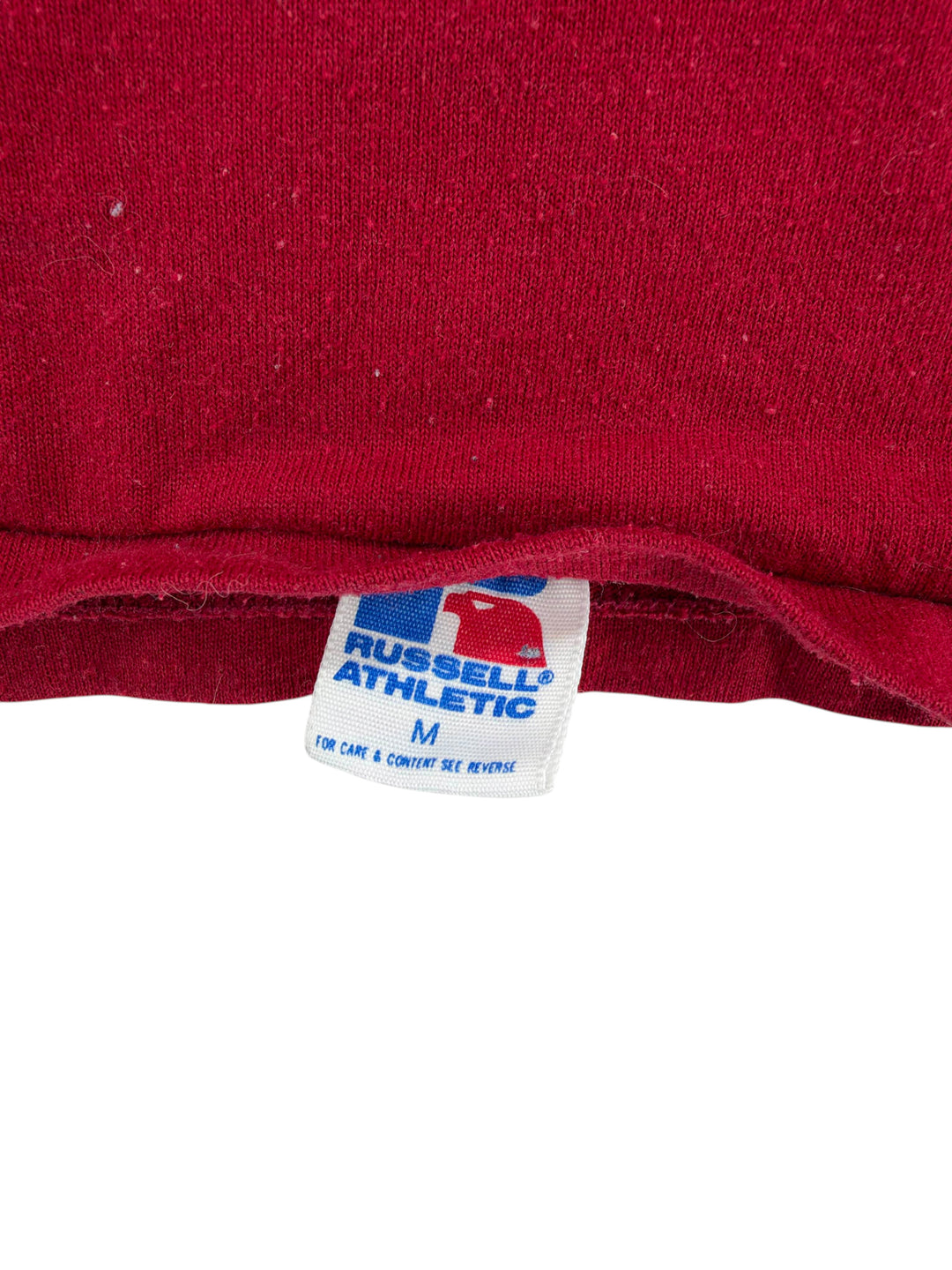 Exile Vintage 1980s Russell Athletic tag on a maroon Minnesota Gophers shirt, size medium.
