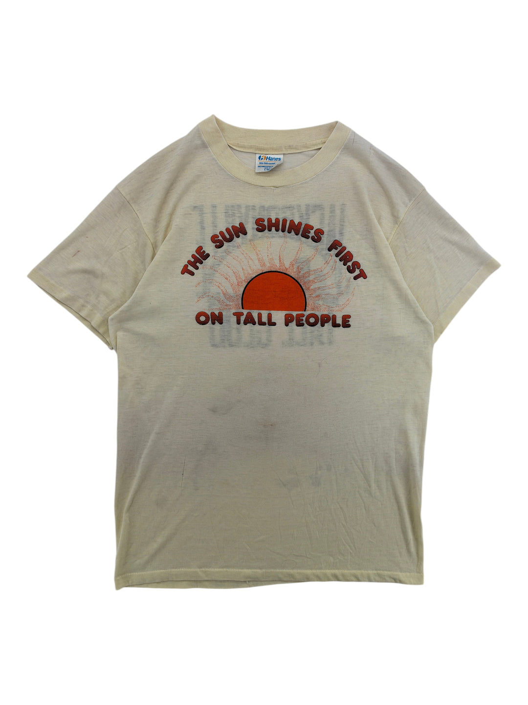 Exile Vintage 1980s cream graphic t-shirt featuring a sun illustration and The Sun Shines First On Tall People text