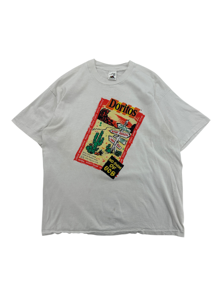 Exile Vintage 1990s white cotton Doritos promo t-shirt with graphic print of a desert scene and snack bag design.