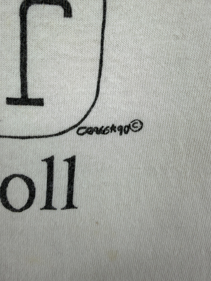 Exile Vintage 1990s Lewis Carroll graphic t-shirt detail showing the 1990 copyright print on white cotton fabric.