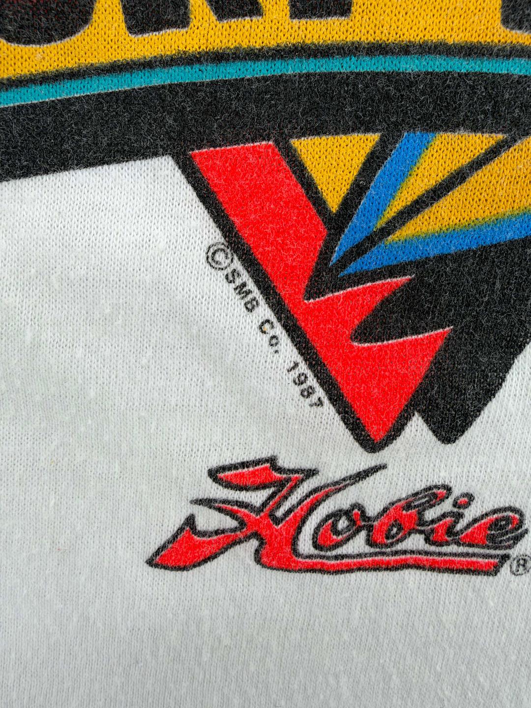 Exile Vintage 1980s Hobie surf t-shirt graphic detail with 1987 copyright print on white cotton fabric