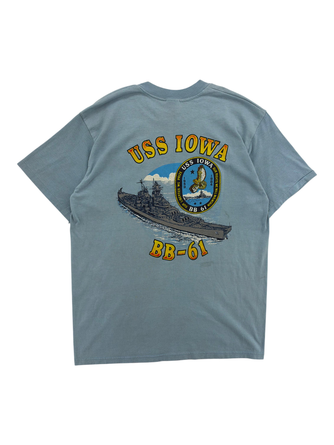 Exile Vintage blue 1980s USS Iowa BB-61 graphic t-shirt featuring a battleship and eagle emblem on the back