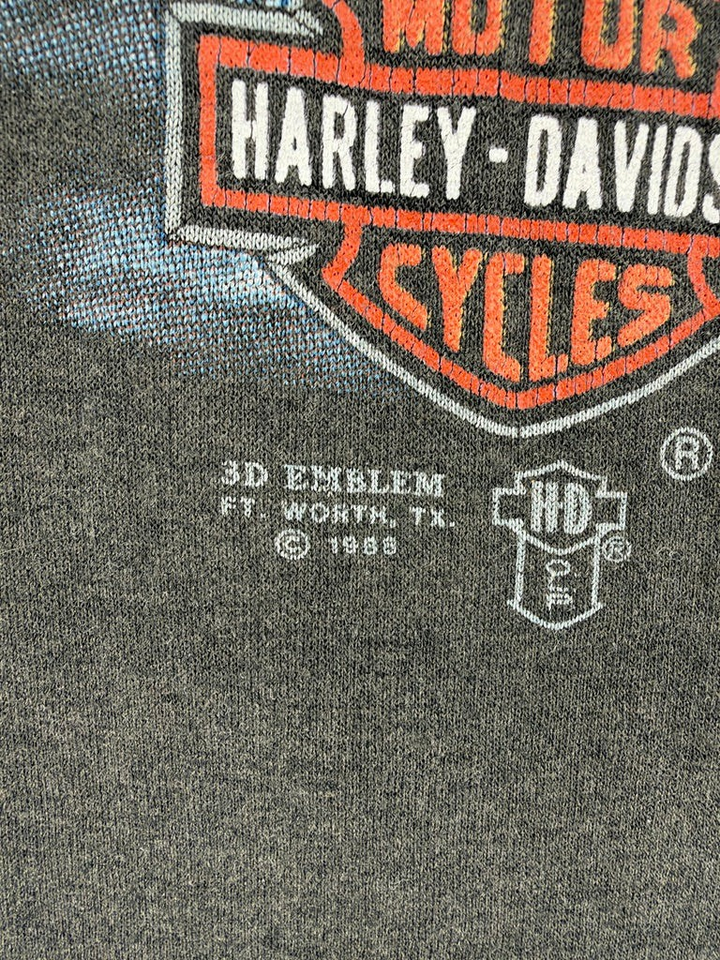 Exile Vintage 1988 Harley Davidson 3D Emblem graphic detail on a faded black cotton t-shirt