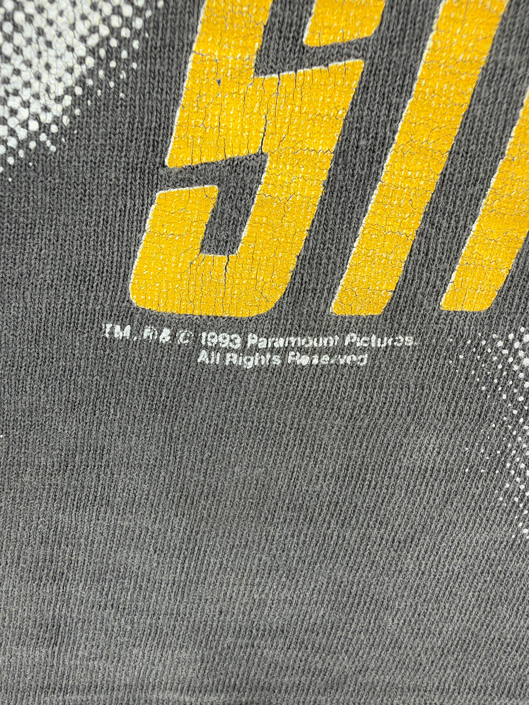Exile Vintage 1993 Star Trek Captain Kirk t-shirt detail showing yellow cracked screen print on grey cotton fabric