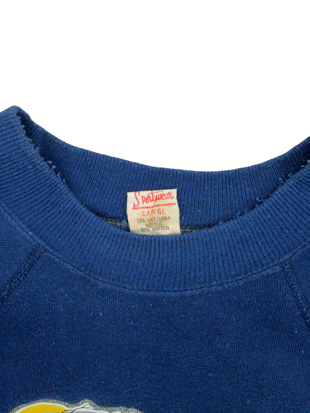 Exile Vintage blue 1980s crewneck sweatshirt with Sportswear tag showing 50% Creslan acrylic and 50% cotton blend