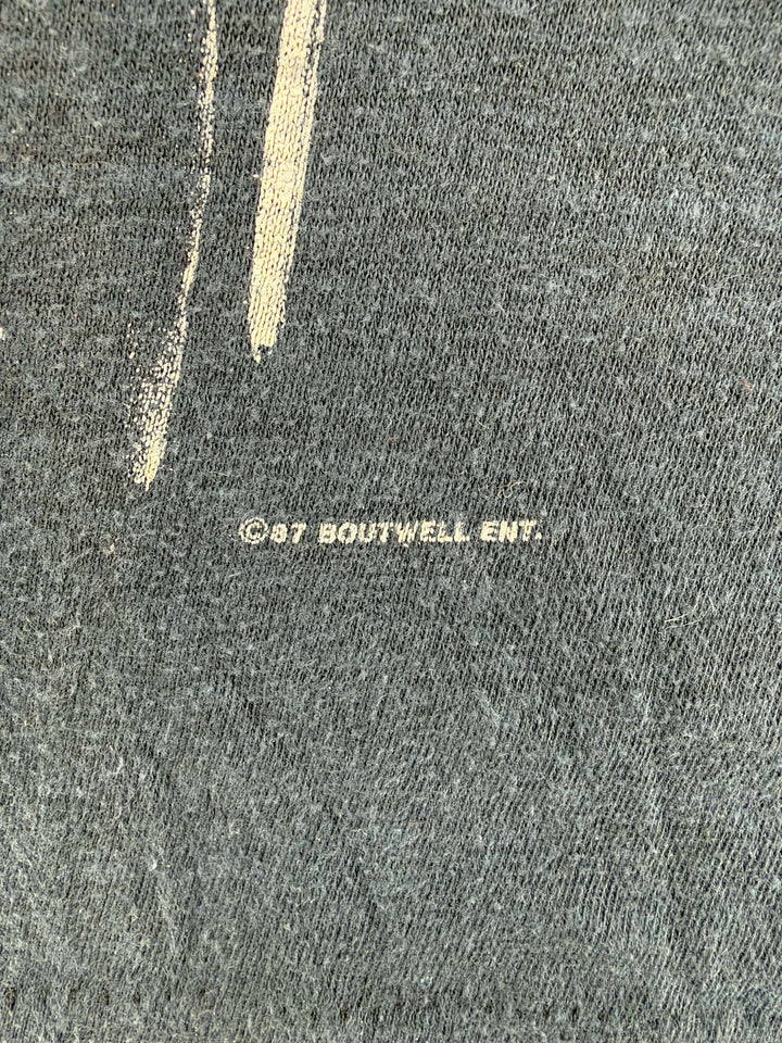 Exile Vintage 1980s Steve Earle tour t-shirt copyright detail showing 1987 Brutwell Ent print on white fabric