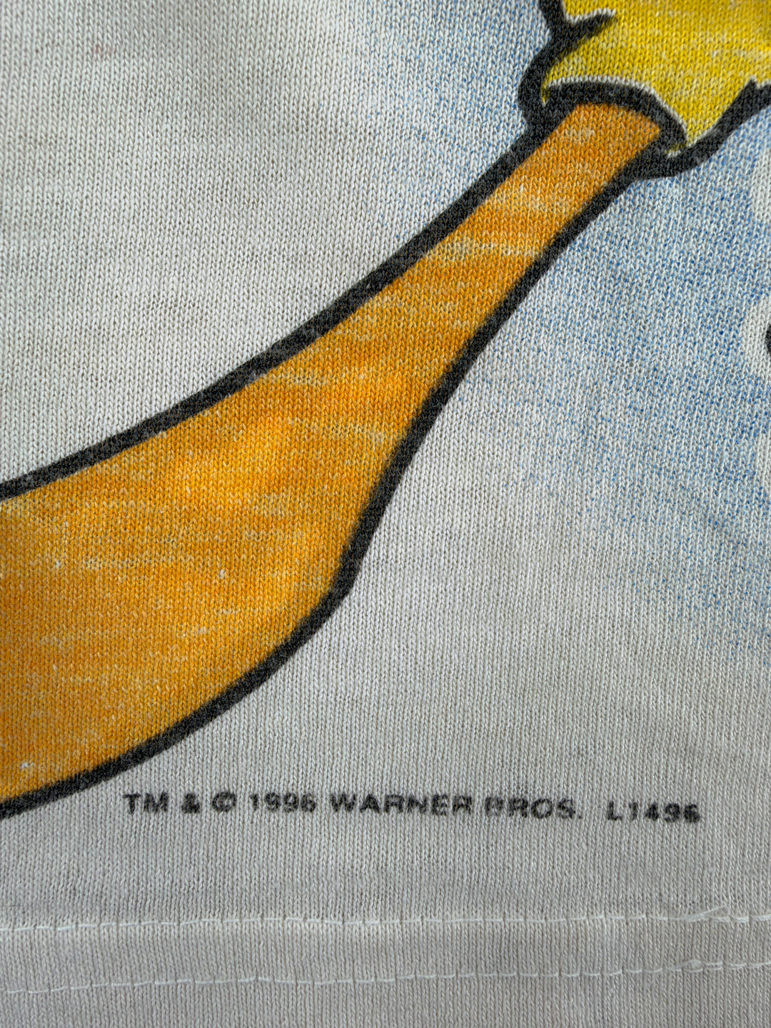 Exile Vintage 1996 Warner Bros Looney Tunes graphic t-shirt detail showing copyright print on white cotton fabric