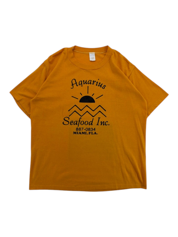 Exile Vintage 1980s mustard yellow cotton t-shirt with black Aquarius Seafood Inc graphic print