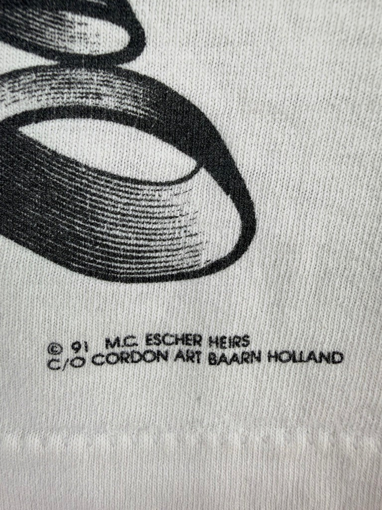 Exile Vintage 1991 M.C. Escher copyright print detail on a white vintage cotton t-shirt