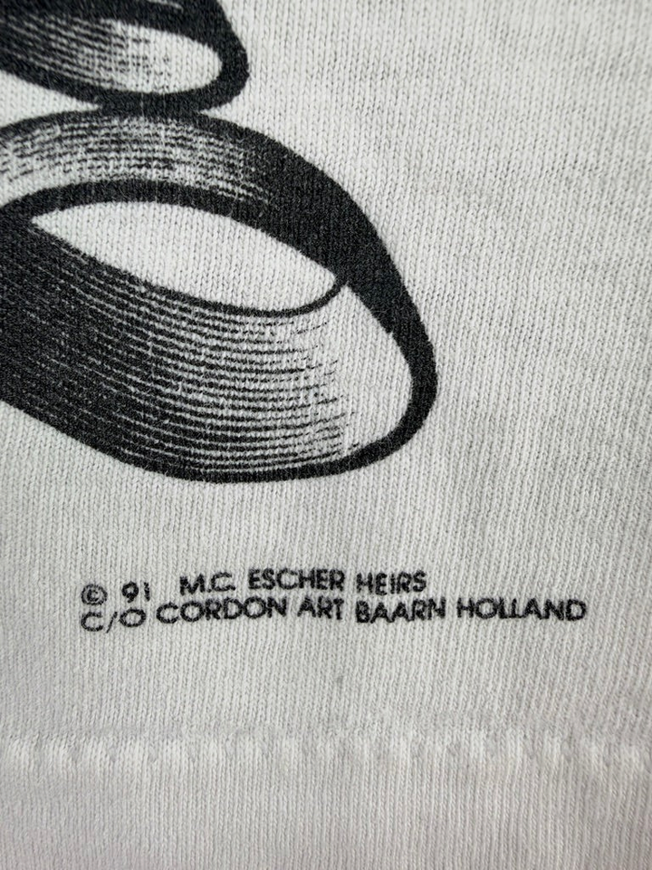 Exile Vintage 1991 M.C. Escher copyright print detail on a white vintage cotton t-shirt