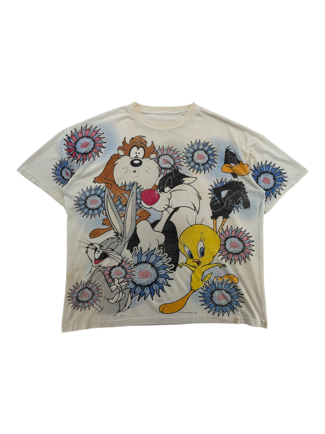 Exile Vintage 1990s Looney Tunes all-over print t-shirt featuring Bugs Bunny, Taz, Sylvester, and Tweety Bird.