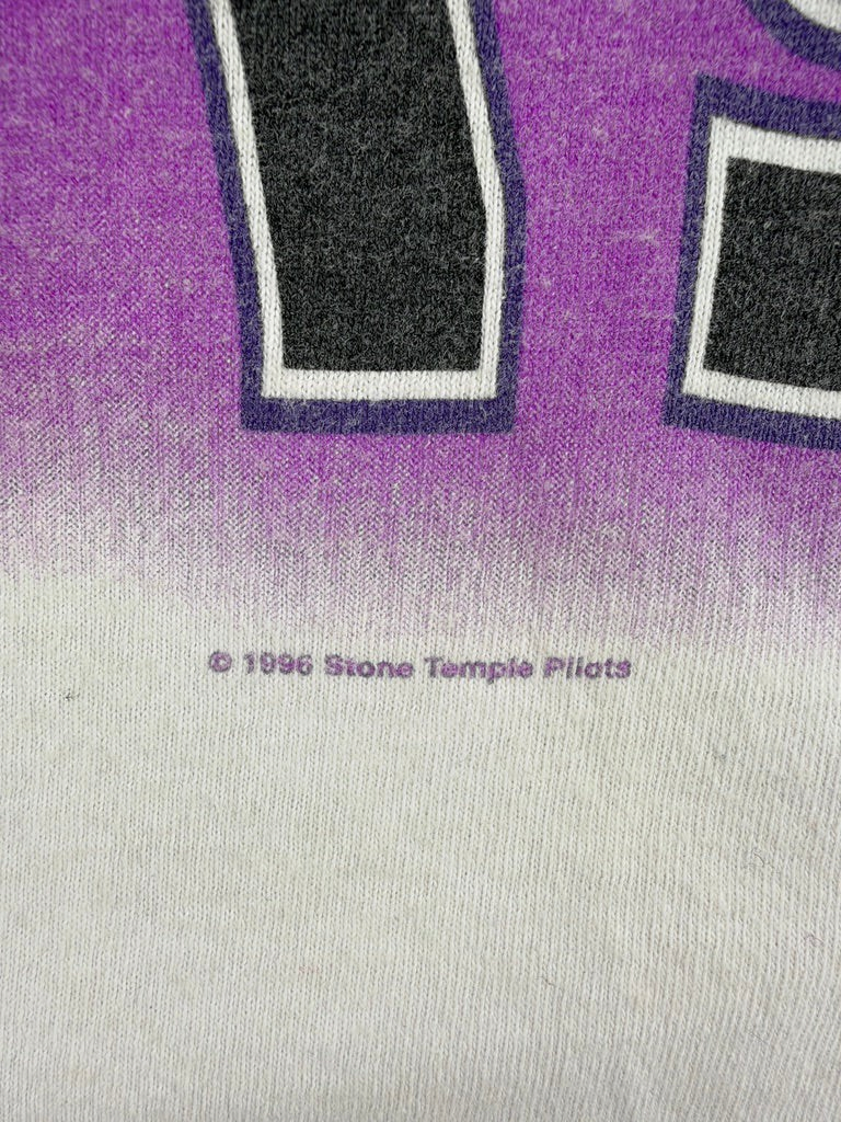 Exile Vintage 1996 Stone Temple Pilots band t-shirt detail showing the copyright print on purple and white fabric