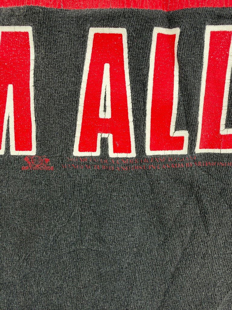 Exile Vintage 1990s Metallica band t-shirt detail showing red graphic text on black cotton fabric