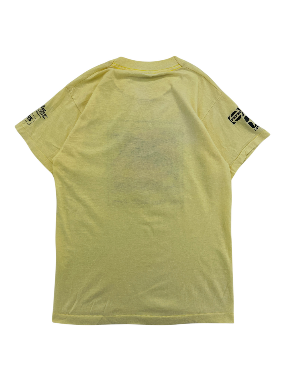 Back view of a vintage yellow Exile Vintage 1980s Sunburst Marathon 5K T-shirt with Pepsi branding on the sleeve.