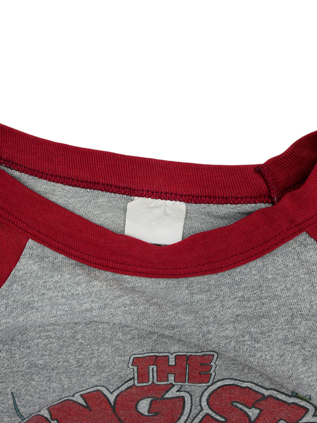 Exile Vintage 1980s Rolling Stones raglan t-shirt with grey body, red collar, and blank interior neck label.