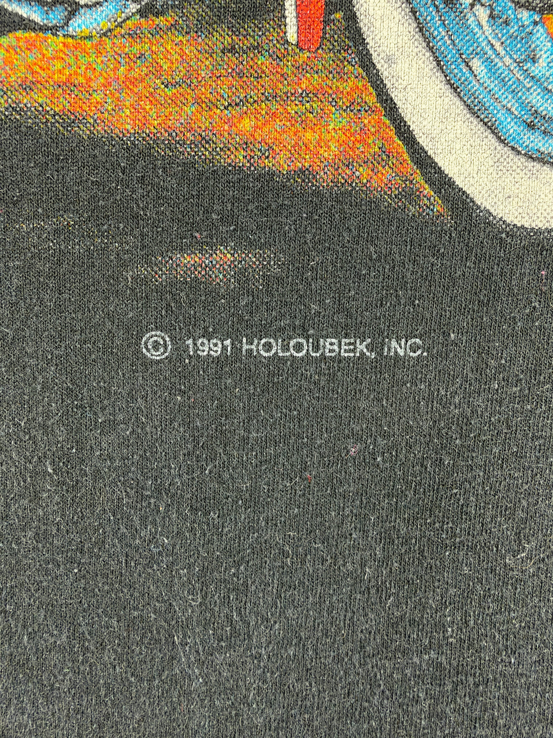 Exile Vintage 1991 Holoubek Inc copyright print detail on a black vintage Harley Davidson graphic t-shirt