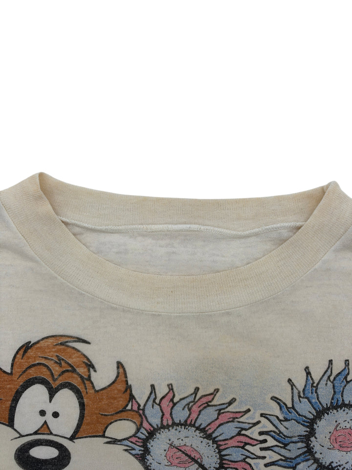 Exile Vintage 1990s Looney Tunes graphic t-shirt with Taz and colorful flowers on off-white cotton fabric