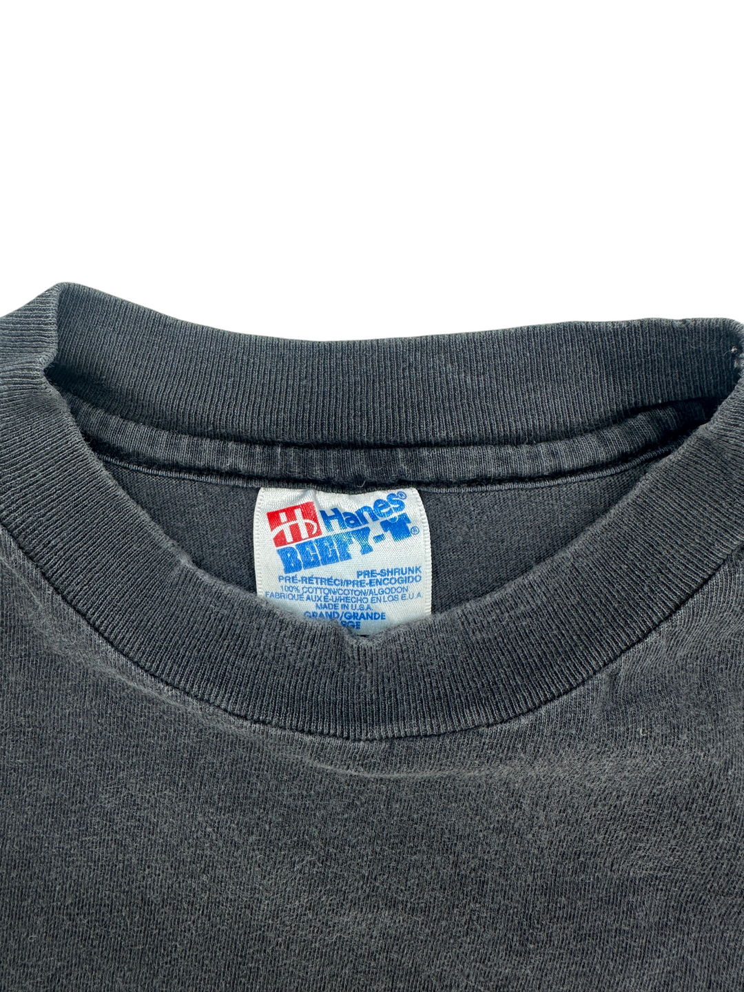 Exile Vintage 1990s Skull City t-shirt featuring a Hanes Beefy-T tag on a faded black cotton crew neck collar