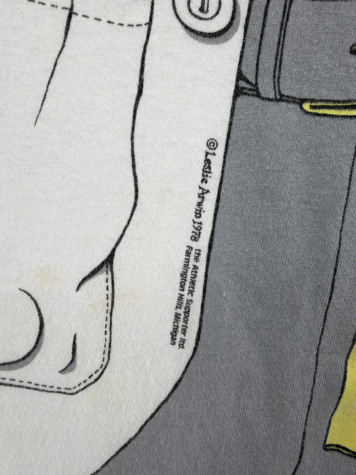 Exile Vintage 1980s graphic t-shirt detail showing 1978 copyright print on white and grey fabric