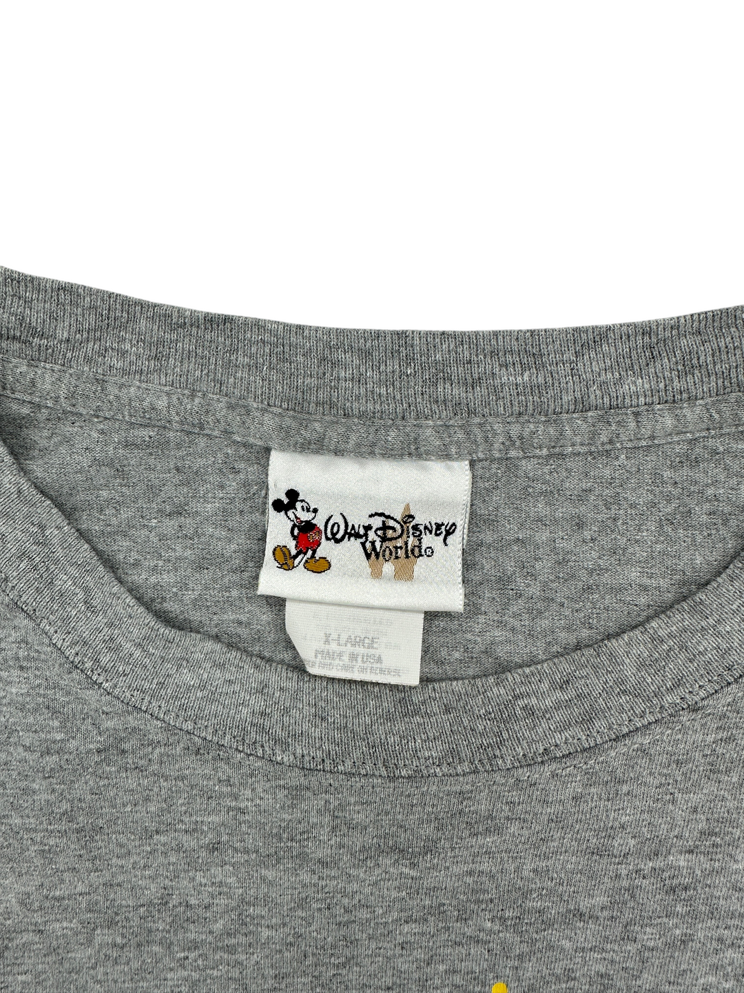 Exile Vintage grey 1990s Walt Disney World Magic Kingdom t-shirt neck label showing size XL and made in USA tag