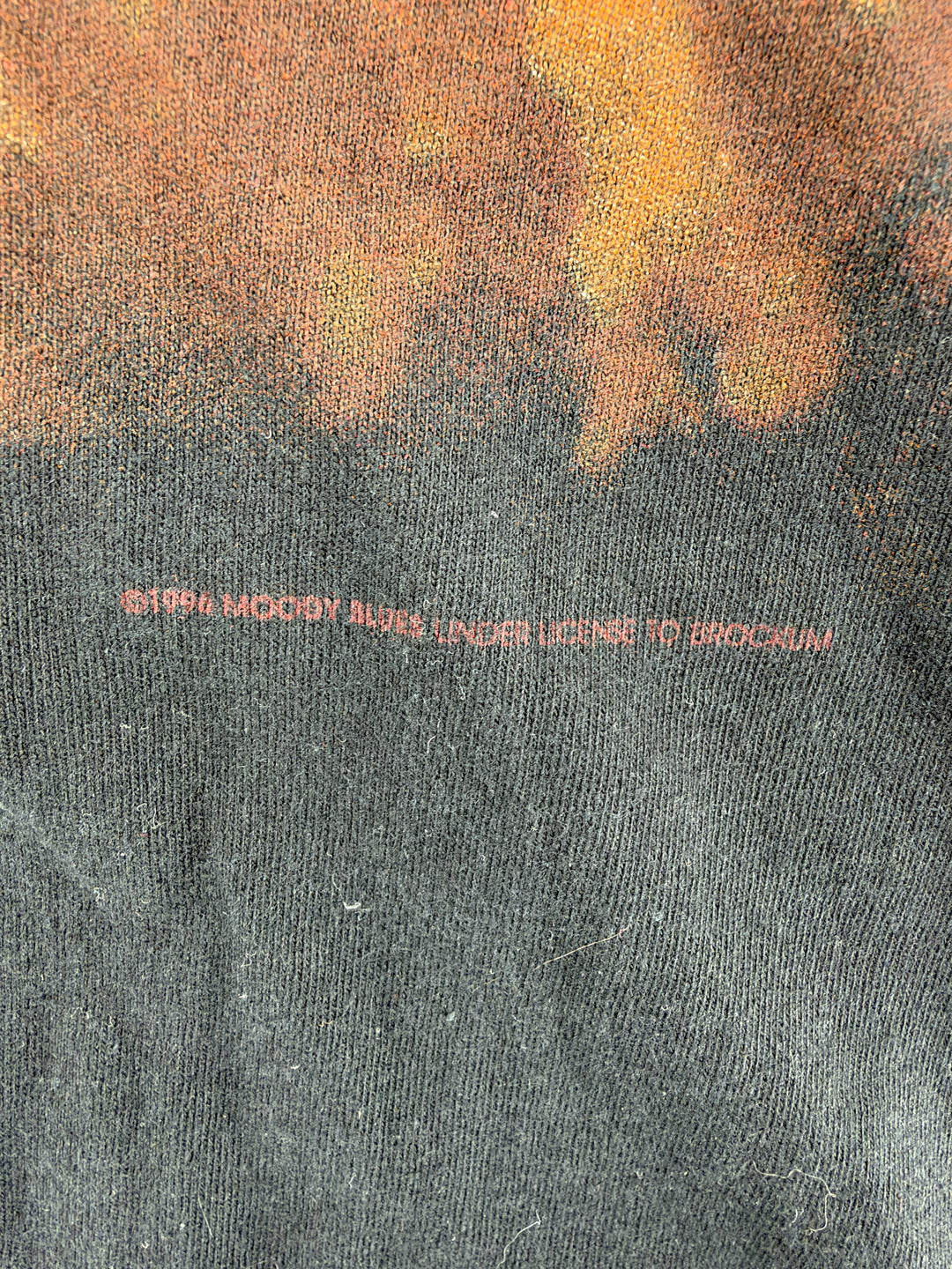 Exile Vintage 1990s The Moody Blues tour t-shirt detail showing the vintage copyright print on black cotton fabric