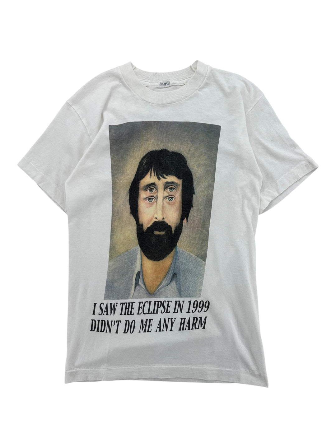 Exile Vintage white graphic t-shirt featuring a surreal portrait with four eyes and the text I Saw The Eclipse In 1999