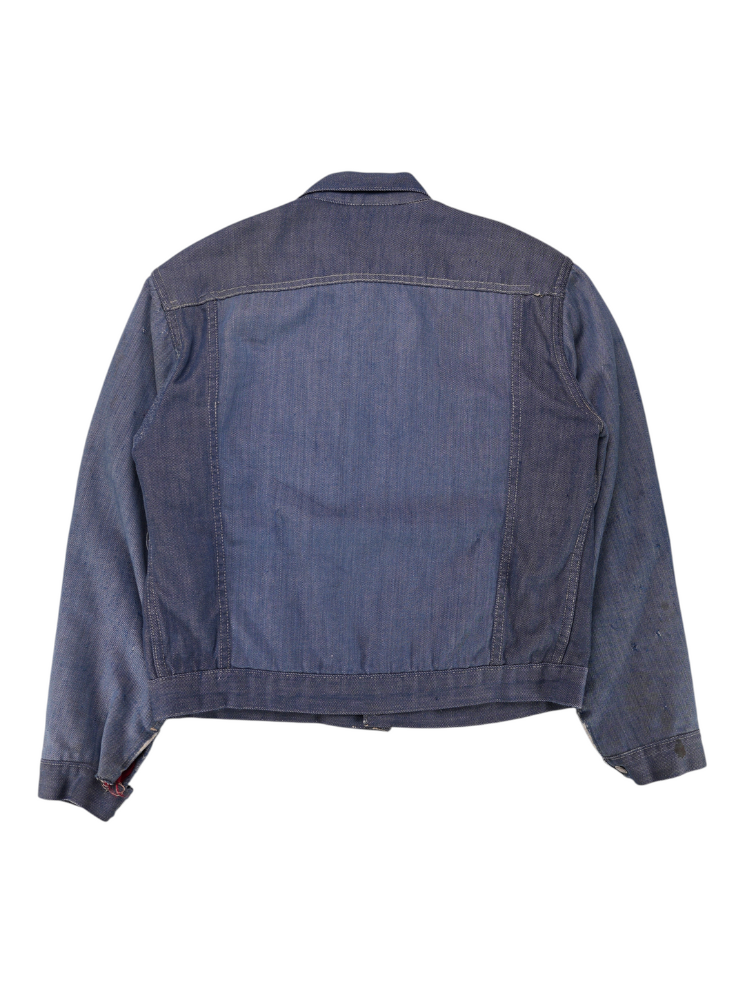 Back view of a vintage 1970s Exile Vintage J.C. Penny Ranchcraft blue denim workwear jacket with pleated details.