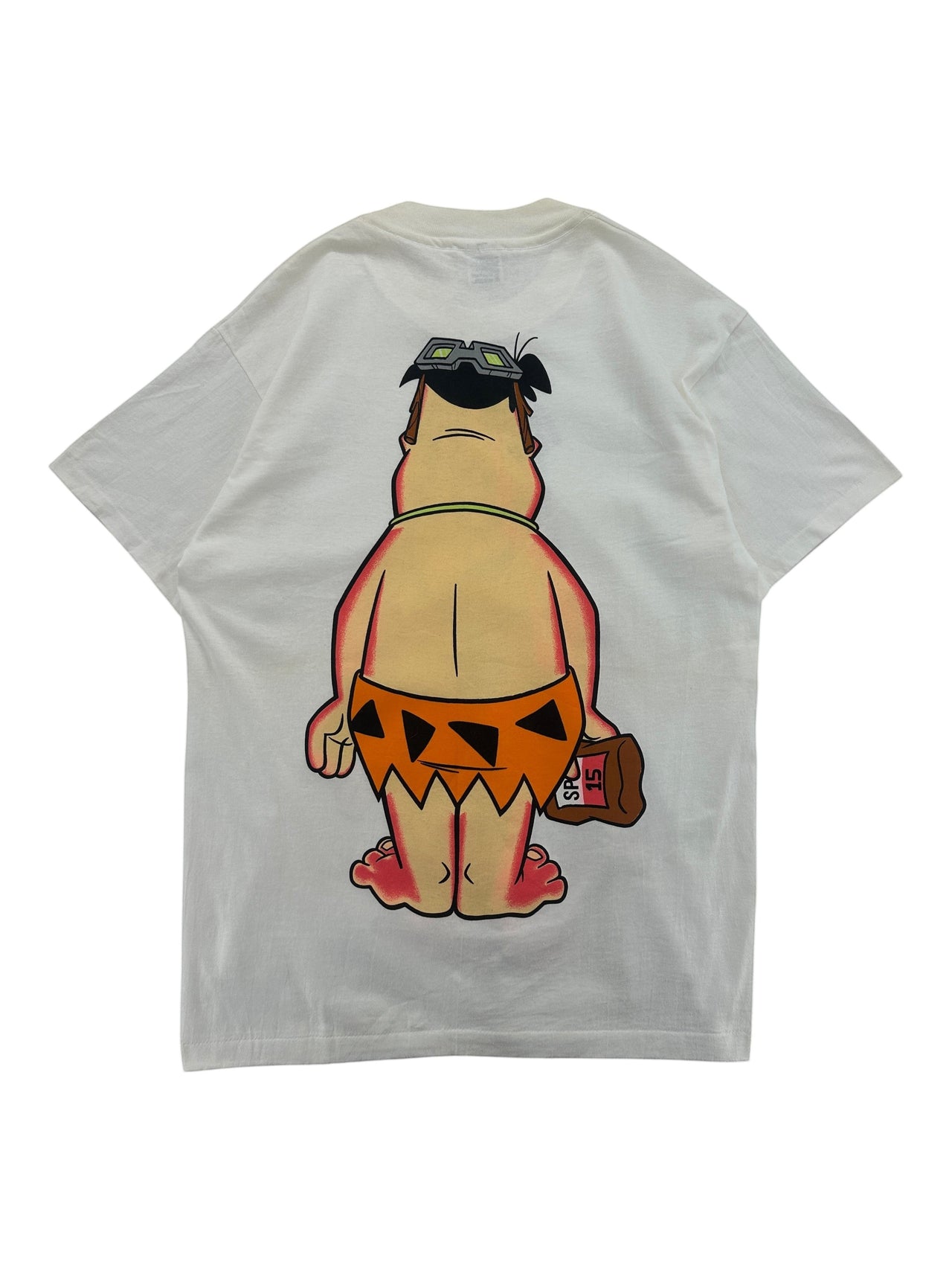 Exile Vintage 1990s white cotton T-shirt featuring a sunburnt Fred Flintstone graphic with sunscreen