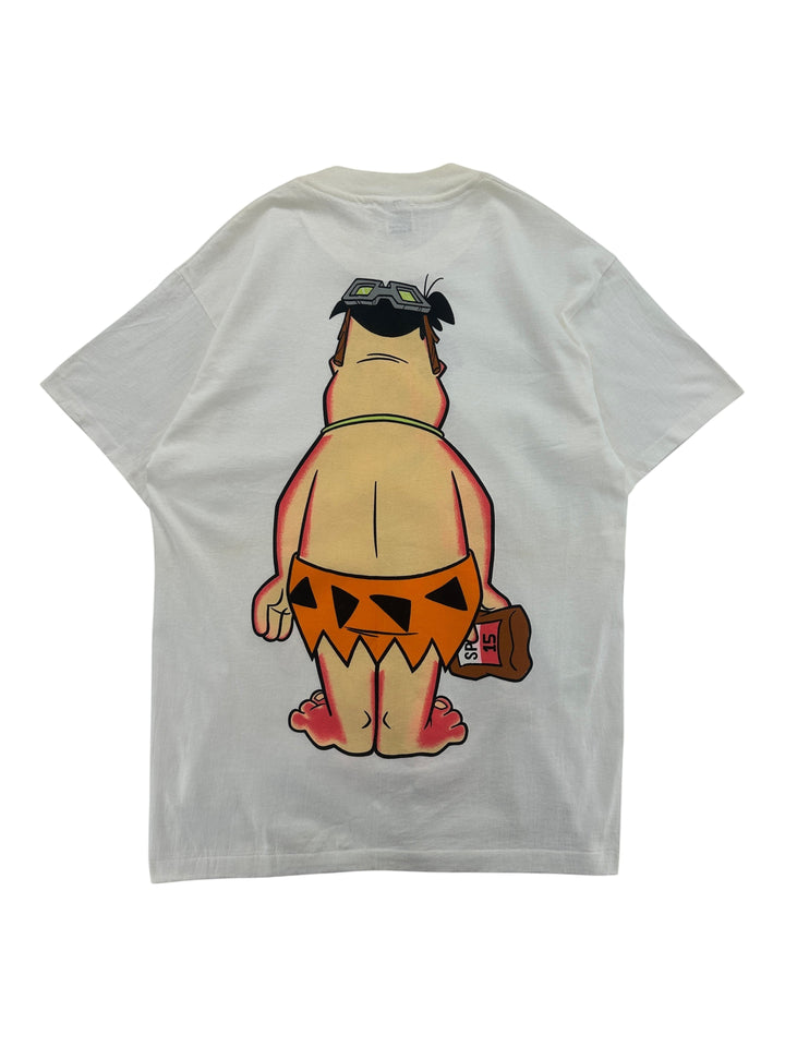 Exile Vintage 1990s white t-shirt featuring a back graphic of Fred Flintstone sunbathing with goggles and a drink.