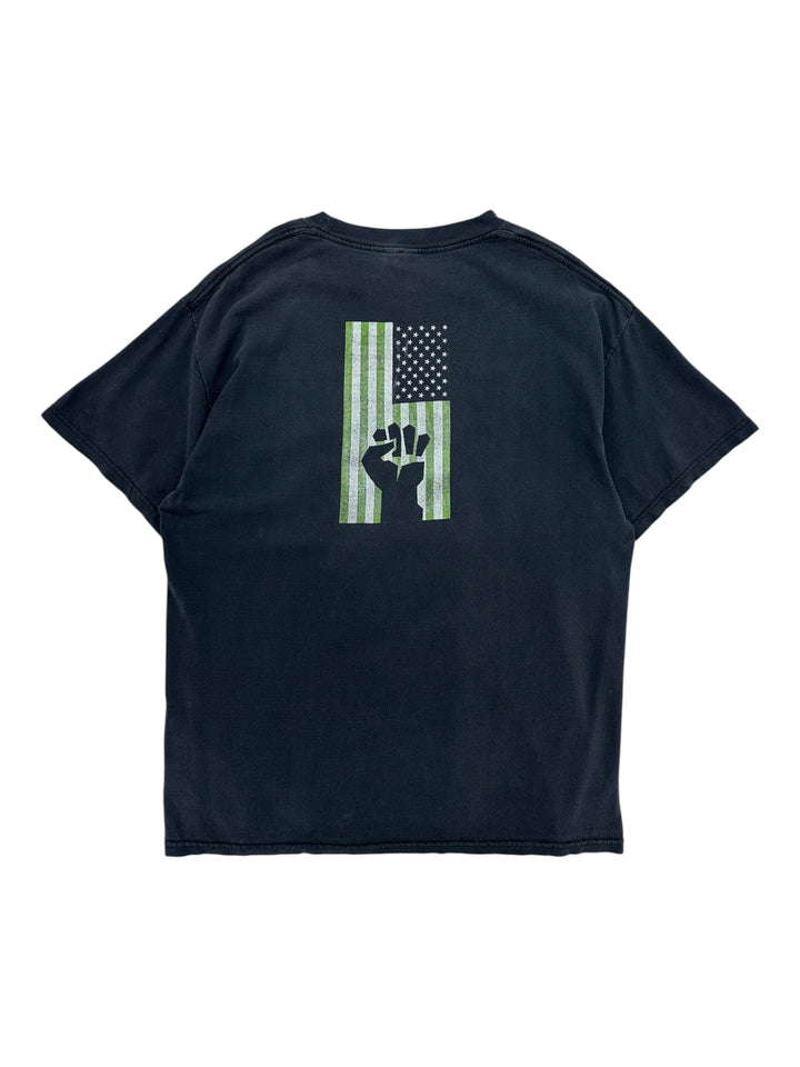 Exile Vintage black 2004 Green Day tour t-shirt featuring a green American flag and raised fist graphic on the back
