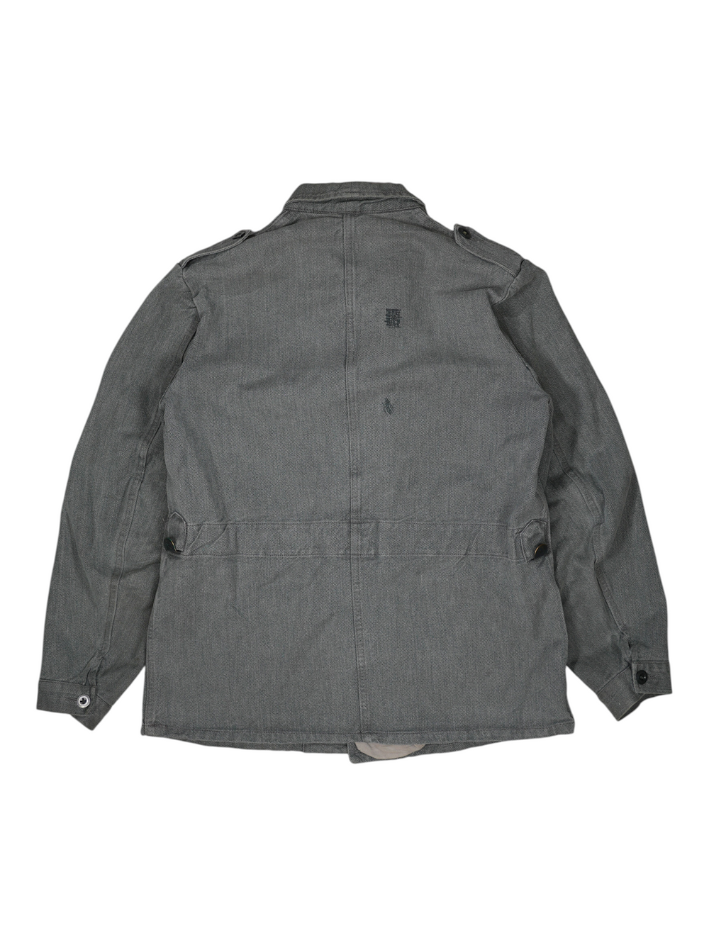 Back view of a grey 1960s Exile Vintage Swiss prison jacket featuring a durable herringbone cotton fabric