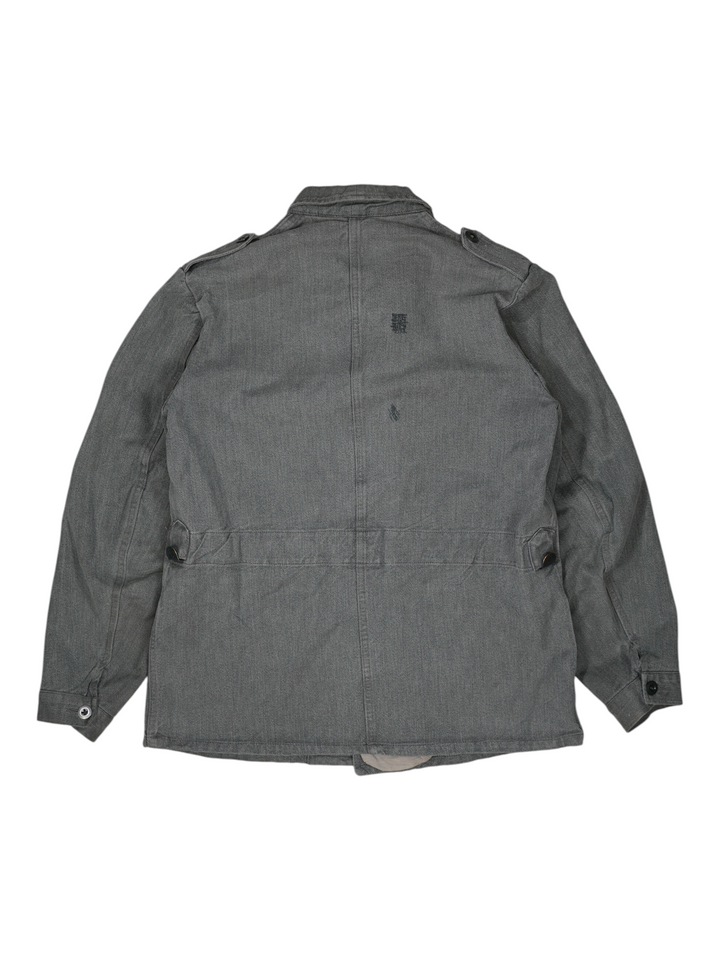 Back view of a grey 1960s Exile Vintage Swiss prison jacket featuring a durable herringbone cotton fabric