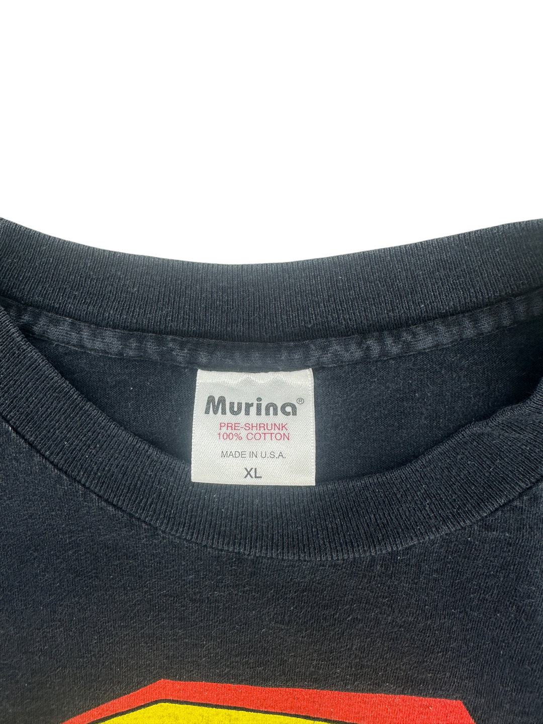 Exile Vintage 1990s The Tick T-shirt featuring a black cotton fabric and a Murina brand tag in size XL